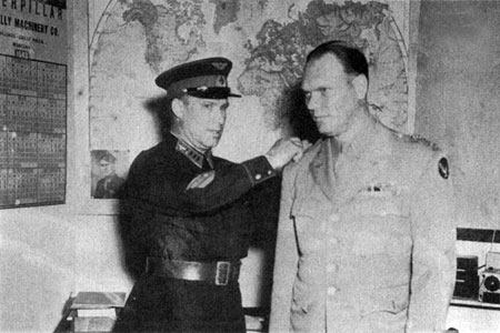 1943: Major George Racey Jordan (right) is decorated by Colonel A. N. Kotikov, head of the USSR lend-lease mission.   Jordan and other witnesses later testified that Presidential advisor Harry Hopkins had shipped the Soviets uranium as well as the secret plans for the atomic bomb.